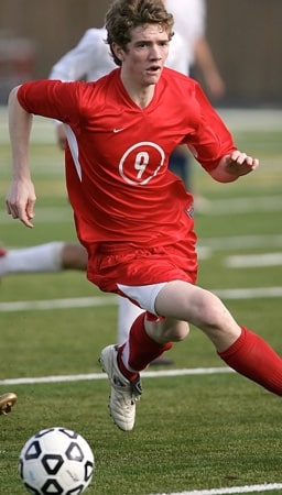 football player dribbling the ball